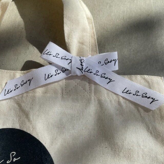 リボン(白地に黒ロゴ)